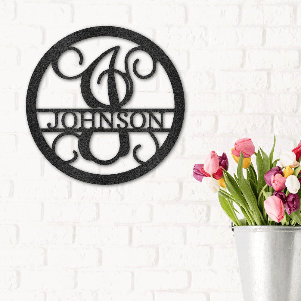 Custom metal wall sign with a monogram initial as well as the last name across the center