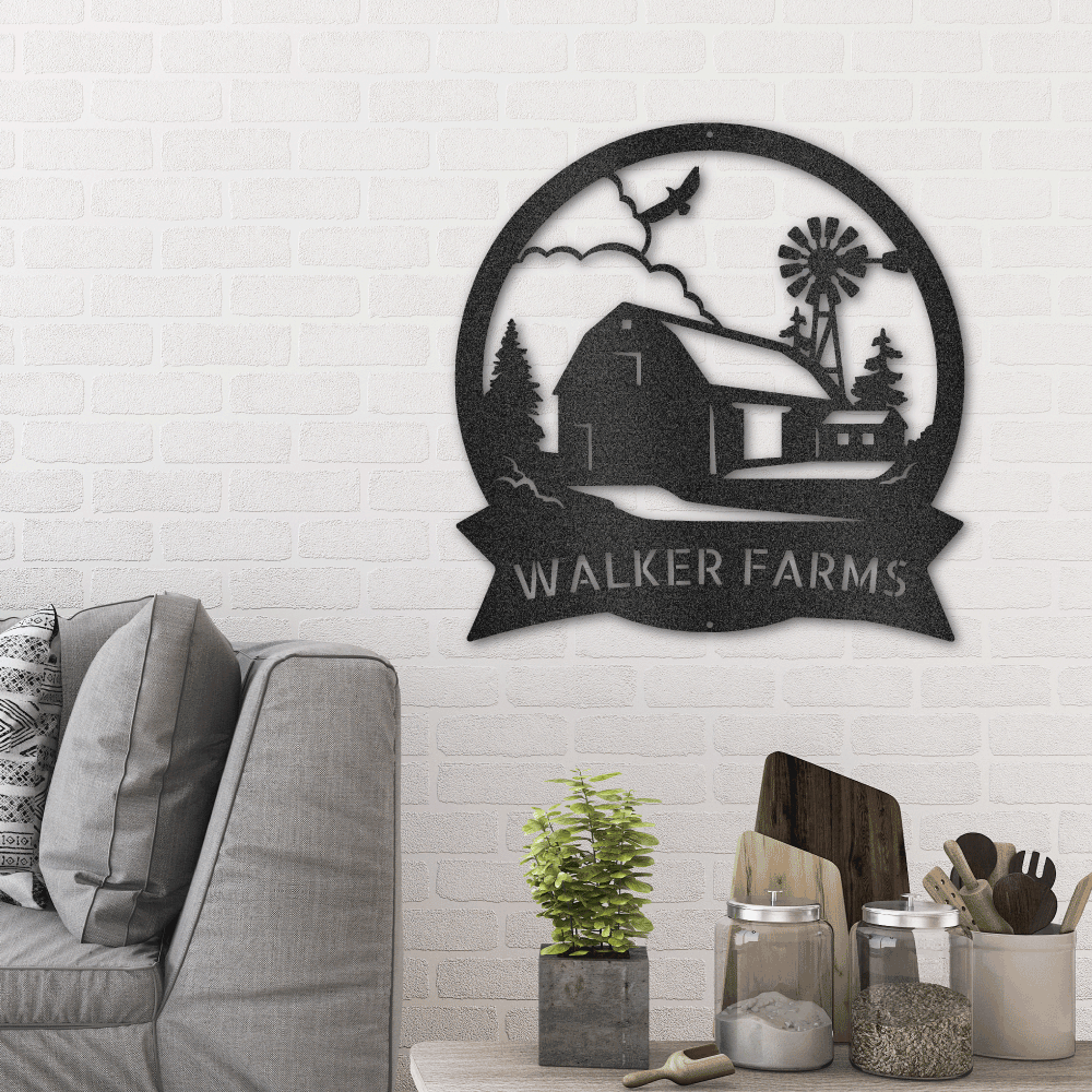 Metal wall art sign of a barn farm house with a custom family name. Hang this as home decor on your wall. The picture shows the custom steel sign in the color black hang in the living room above a couch