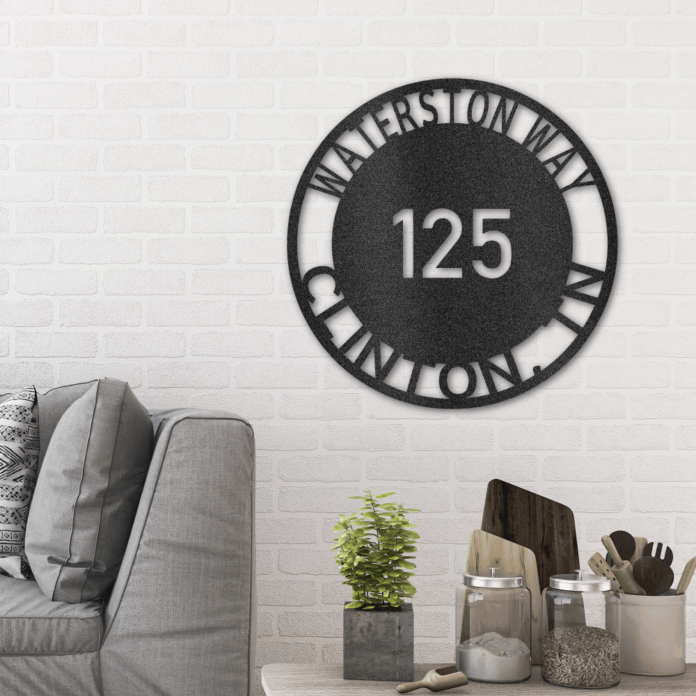 Metal wall art sign for your address. It is a circle with your street name or familly name that you can hang next to your front door, on your porch or a fence. This picture shows the design in the color black