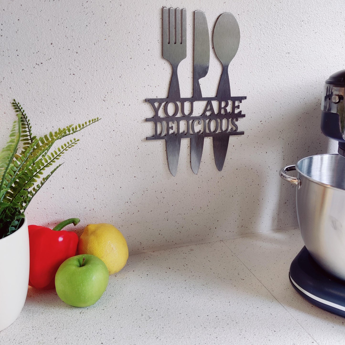 Metal wall art sign for the kitchen hanging on the wall as kitchen decor in the color silver