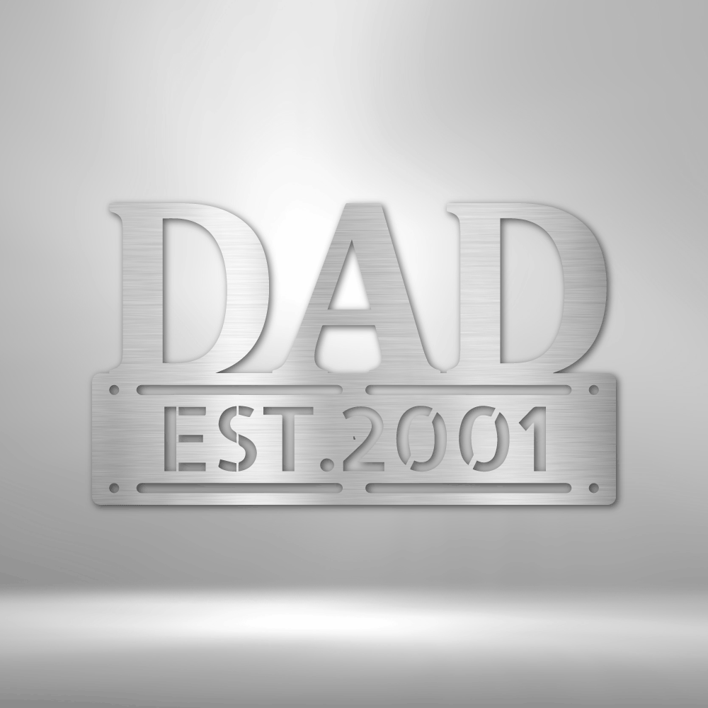 Personalized metal wall art sign of the word DAD in bold writing. You can personalize the row underneath it with a name or date. Use this as a gift for Father's Day. This picture shows the design in the color silver