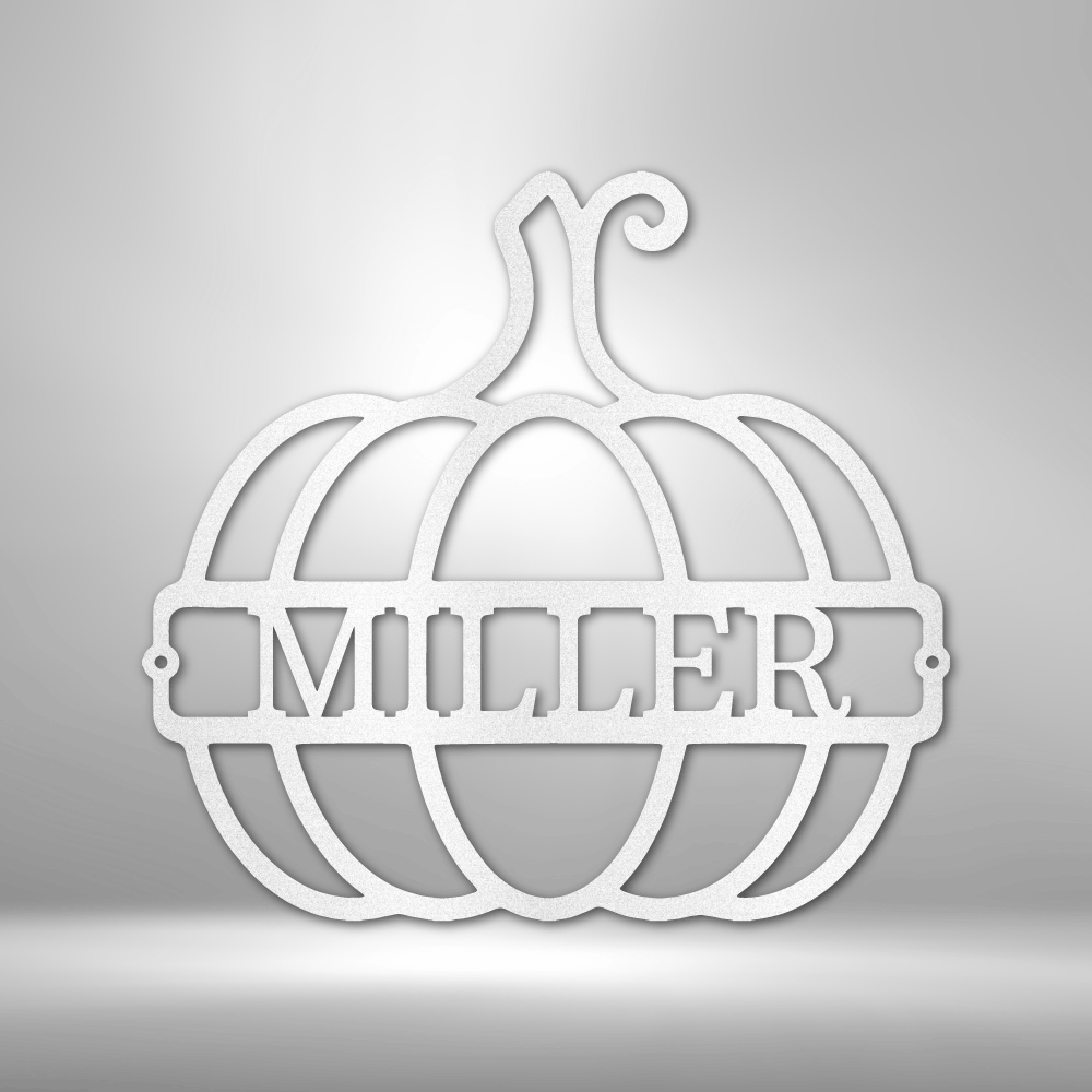 Outline of a pumpkin with a name inside of it as a metal wall art piece in the color white