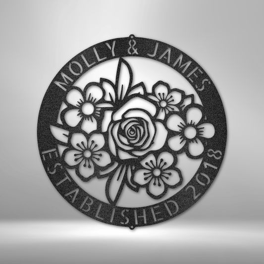 Metal Wall Art Sign of Flowers inside a personalizable ring hanging on the wall in the color black