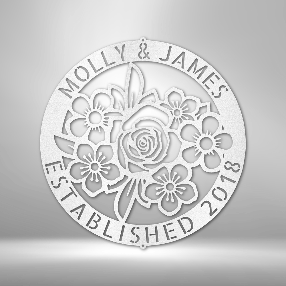 Metal Wall Art Sign of Flowers inside a personalizable ring hanging on the wall in the color white