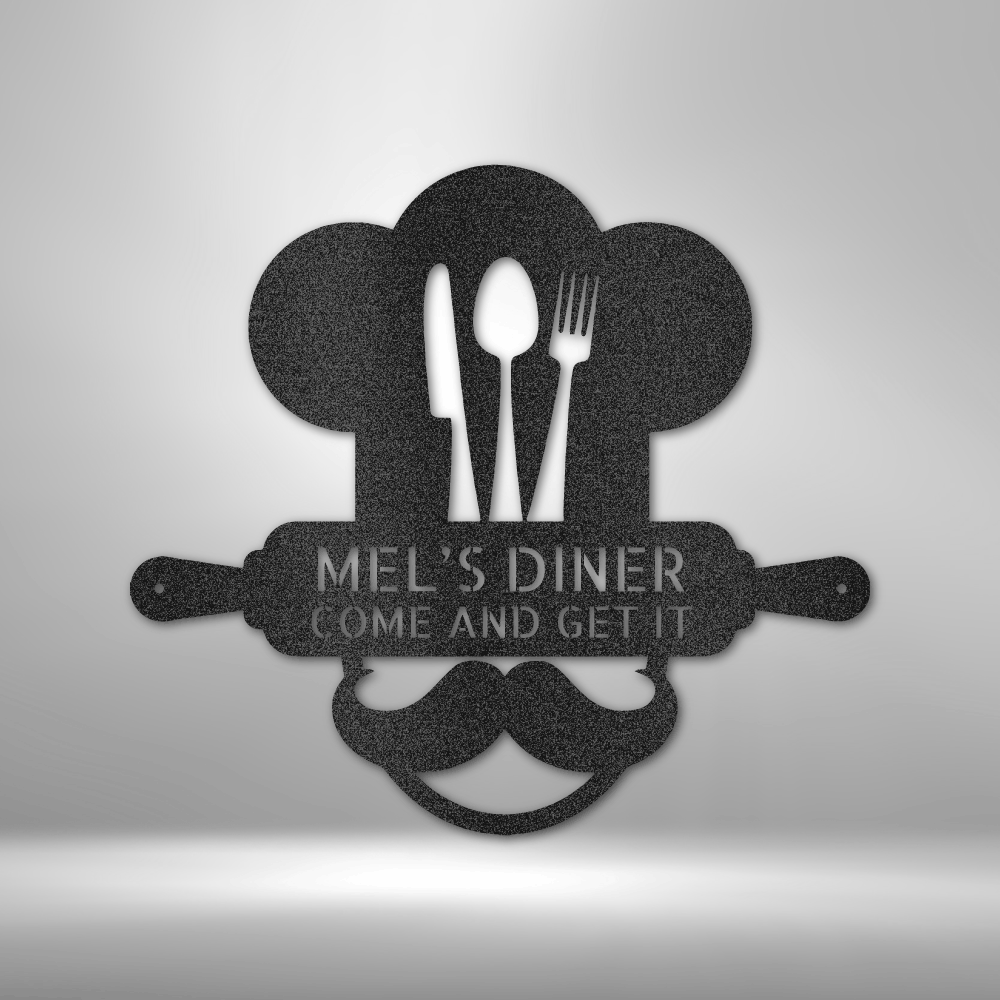 Metal Wall Art Sign of A Cooking chef with a chef's hat and a rolling pin that you can personalize with your own custom text or names. Hanging on the wall . It has the color black.