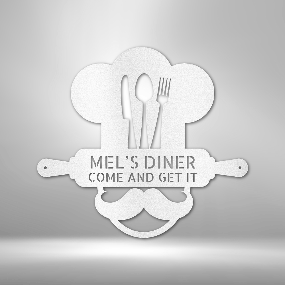 Metal Wall Art Sign of A Cooking chef with a chef's hat and a rolling pin that you can personalize with your own custom text or names. Hanging on the wall . It has the color white.