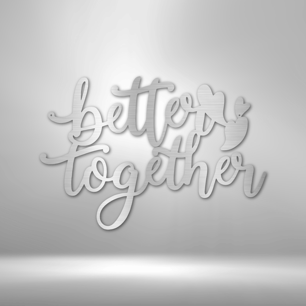 Metal wall art sign that is the quote 'Better Together' with three little hearts. A perfect gift for a loved one. Hang this on your wall for years to come. This picture shows the design in the color silver