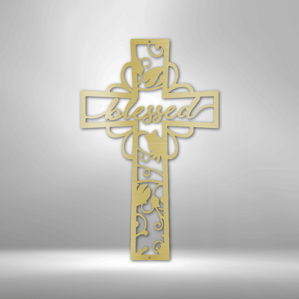 Metal wall art sign of a christian cross with the word blessed inside it. The piece is decorated with metal leafs. The picture show the design in the color gold