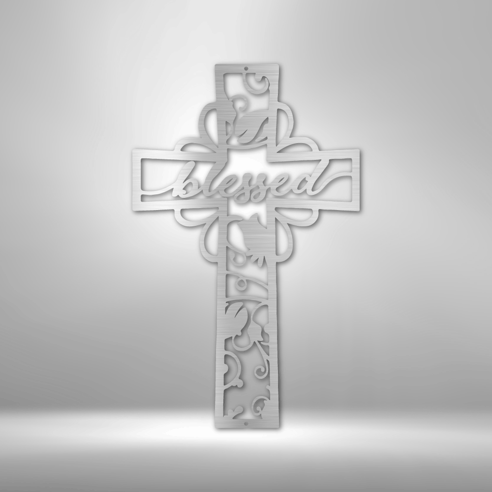 Metal wall art sign of a christian cross with the word blessed inside it. The piece is decorated with metal leafs. The picture show the design in the color silver