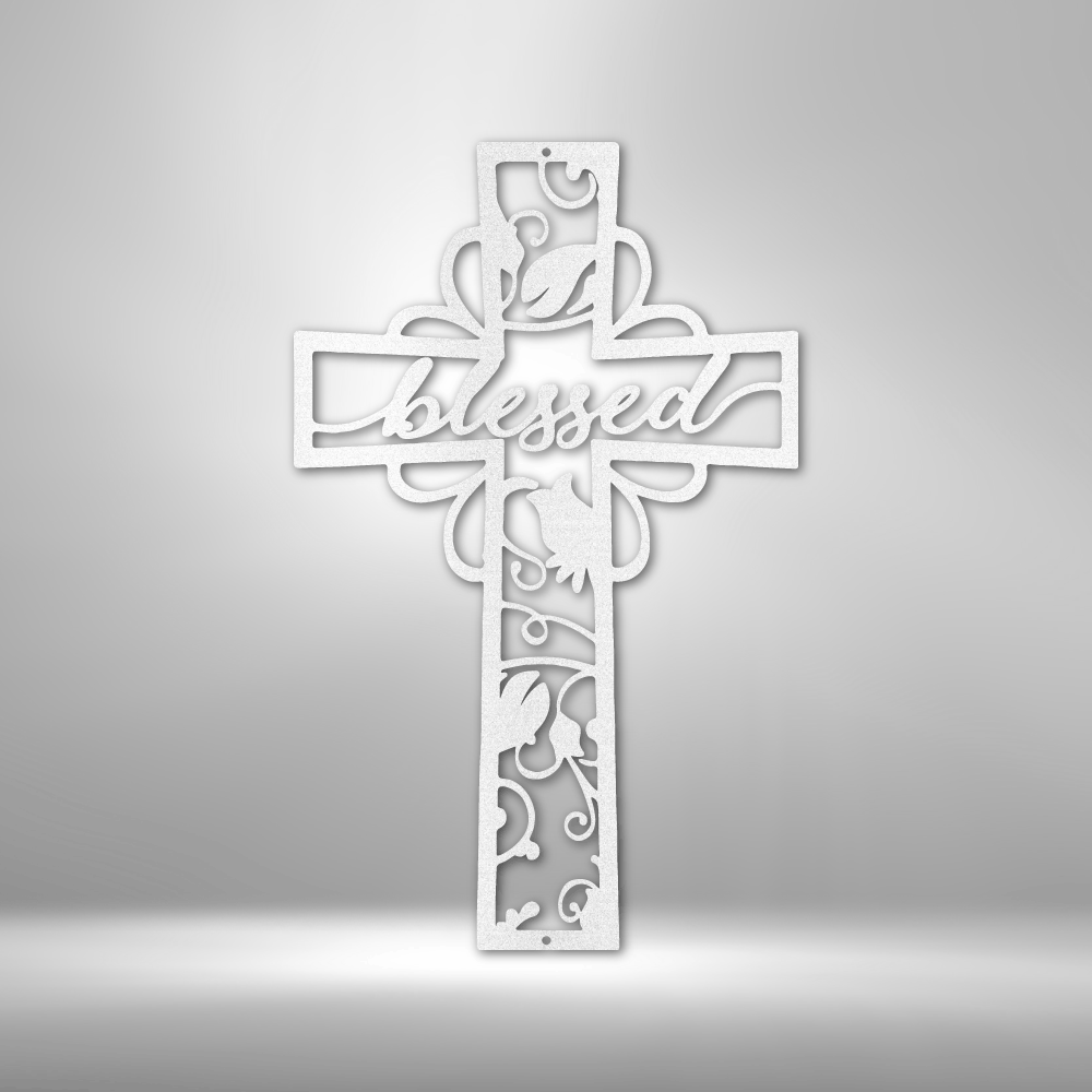 Metal wall art sign of a christian cross with the word blessed inside it. The piece is decorated with metal leafs. The picture show the design in the color white