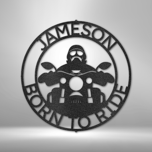 Metal Wall Art sign of a biker on a motorcycle with the text born to ride with a custom name. Personalize this home decor piece as a gift. This picture shows the design in the color black