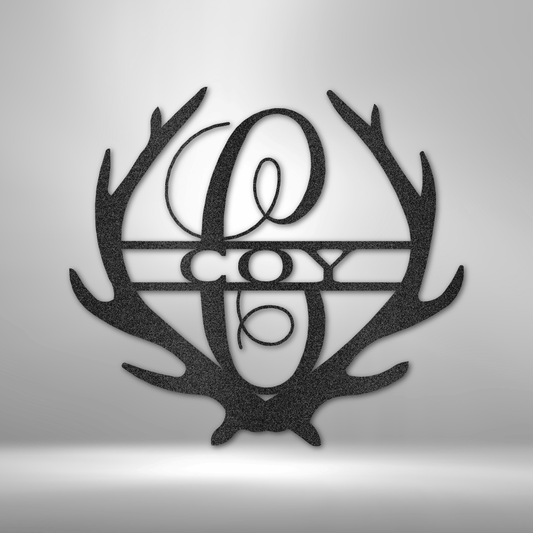 Metal Wall Art Sign of two antlers with a monogram and name inside in the color black