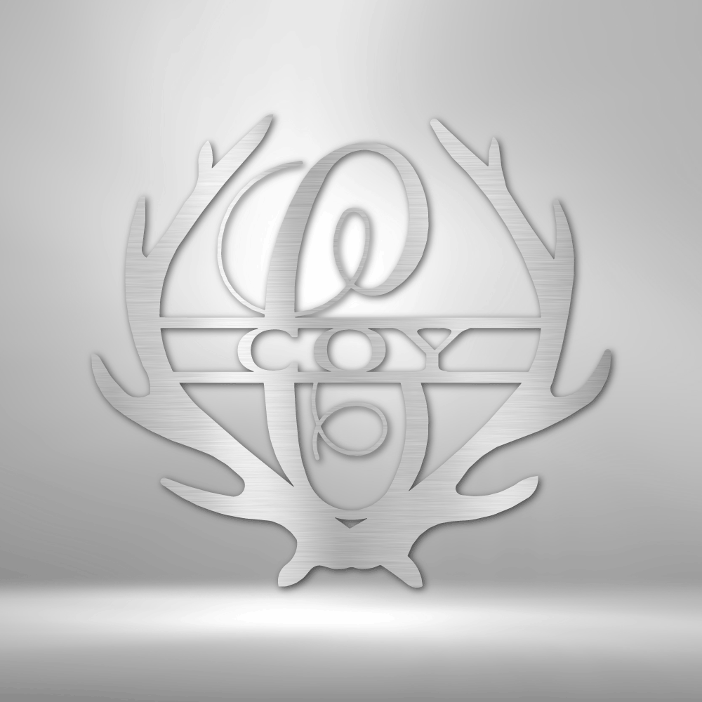 Metal Wall Art Sign of two antlers with a monogram and name inside in the color silver
