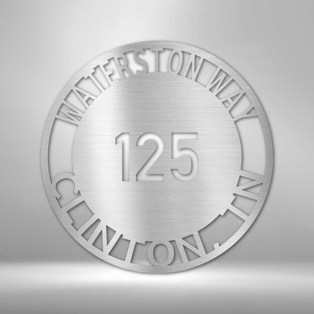 Metal wall art sign for your address. It is a circle with your street name or familly name that you can hang next to your front door, on your porch or a fence. This picture shows the design in the color silver