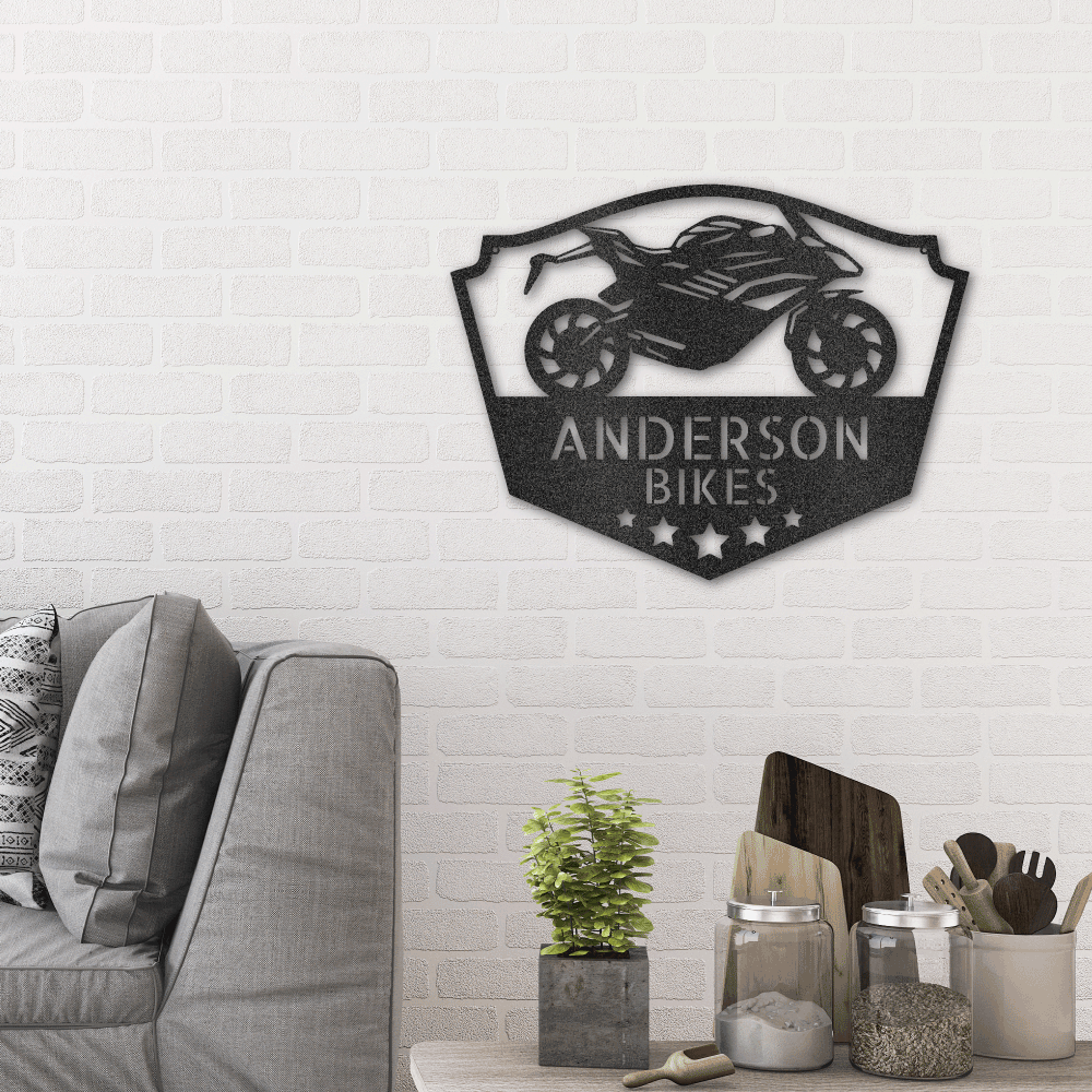Metal wall art sign of a motorcycle to use as decor in a workshop, garage, bike shop or man cave. This picture show the design in the color black hanging in the living room above a couch.