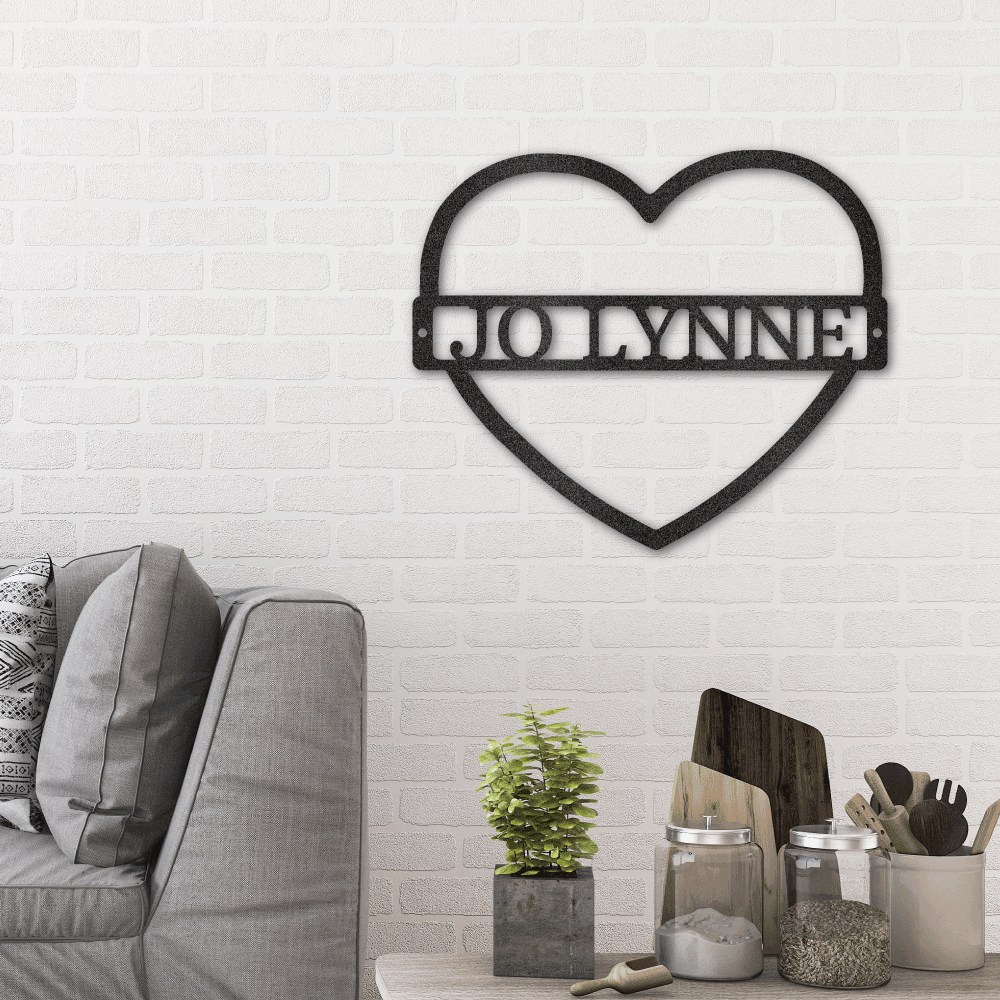 Metal Wall Art Sign in a heart shape with a custom name or text inside of it. Minimalism design. Hanging on the wall in the color black