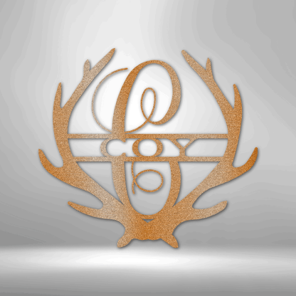 Metal Wall Art Sign of two antlers with a monogram and name inside in the color copper