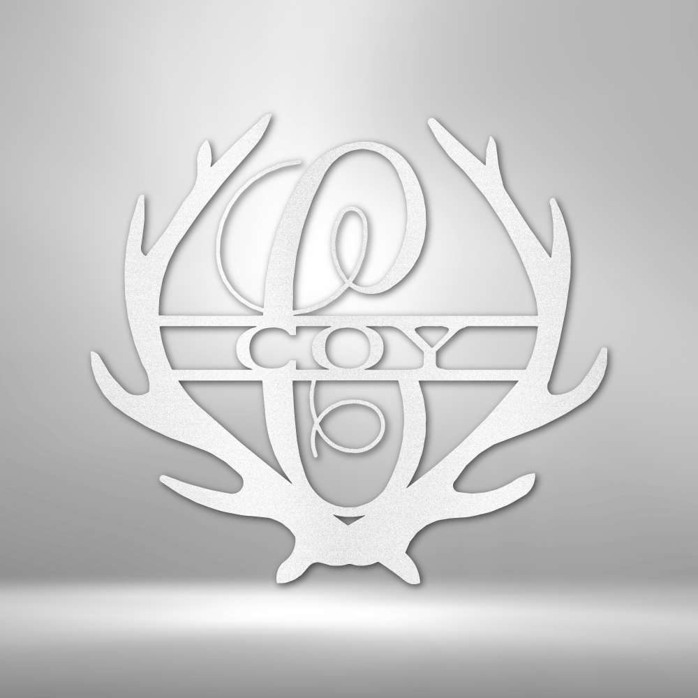 Metal Wall Art Sign of two antlers with a monogram and name inside in the color white